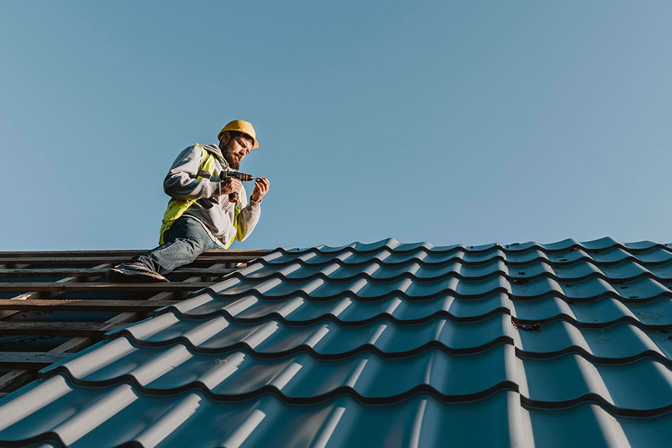 view of a person doing roof repair